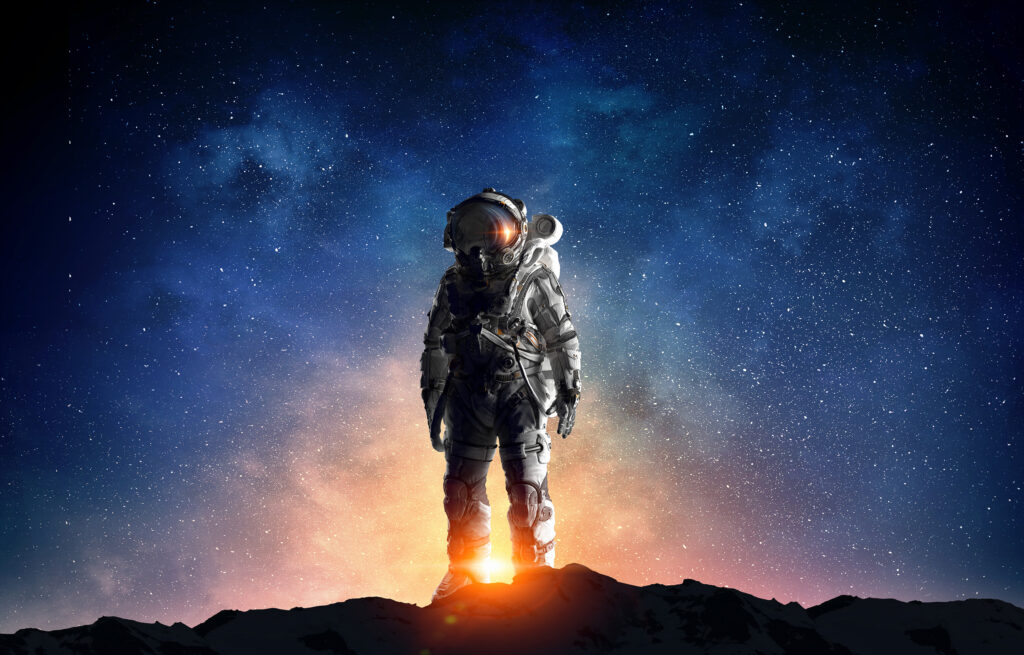 Astronaut med stjärnhimmel i bakgrunden