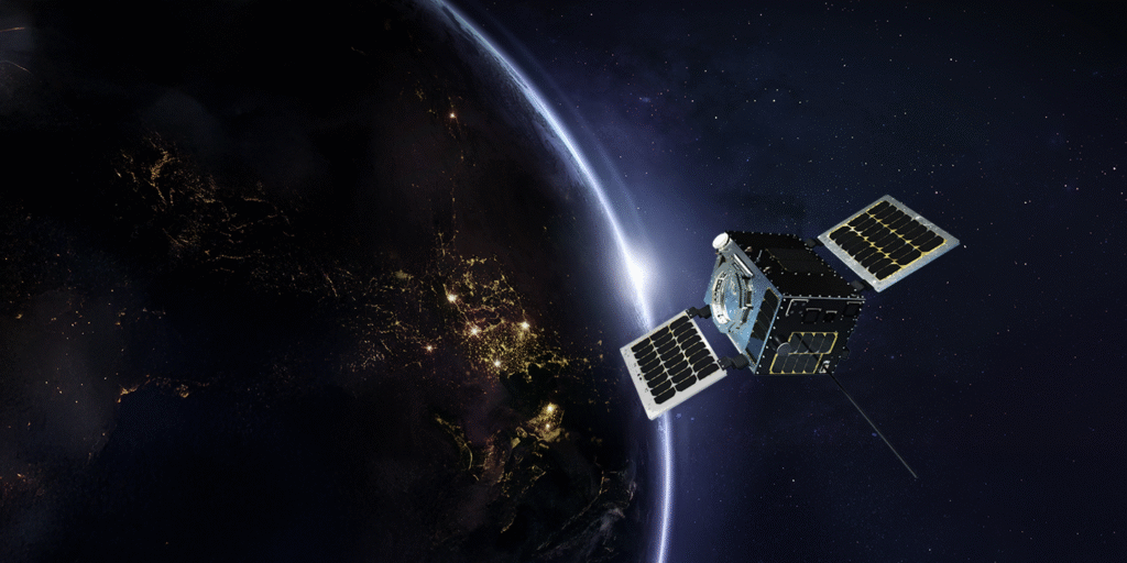 Satellit i rymden med jorden i bakgrunden